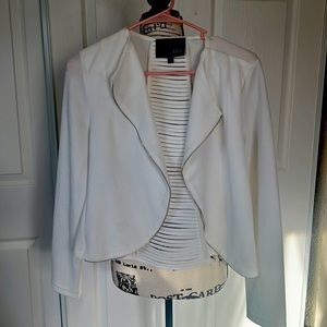 Selling this beautiful white with silver zip blazer